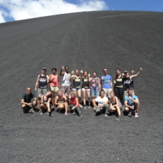 We pose for a photo with our fellow Volcano Boarders at the end of our Big Foot Hostel Tour. Photo: Our Guide Jose
