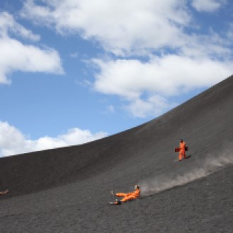 A guide uses a speed gun to ducument how fast boarders make it down Cerro Negro. Big Foot Hostel runs the only tour with a speed gun. Photo: Alex Washburn